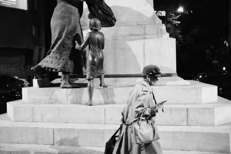 Woman with bags and a phone in hand, Bucharest, Romania