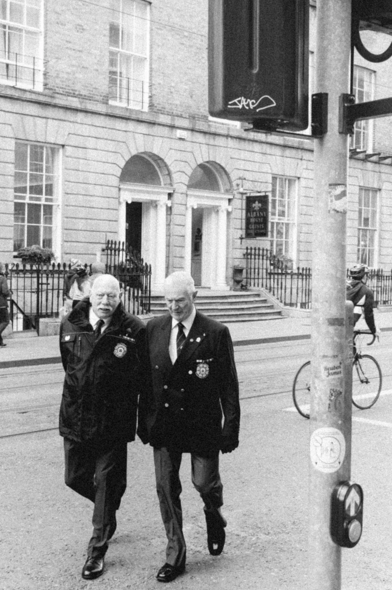 Men in uniform, crossing the road, Dublin, Ireland